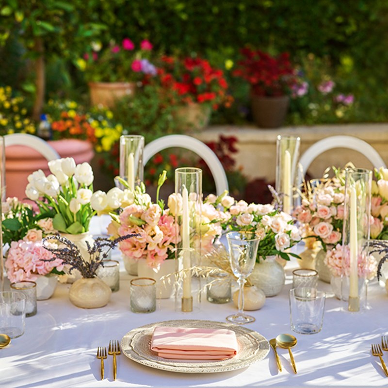 The Garden Terrace - table set up with flower arrangement and candles.